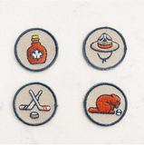 Canadian emblem iron-on patches. Contains a Maple syrup patch, mountie patch, beaver patch, and a hockey sticks patch,