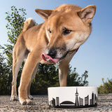 shiba inu with Toronto dog bowl displaying Toronto skyline graphic